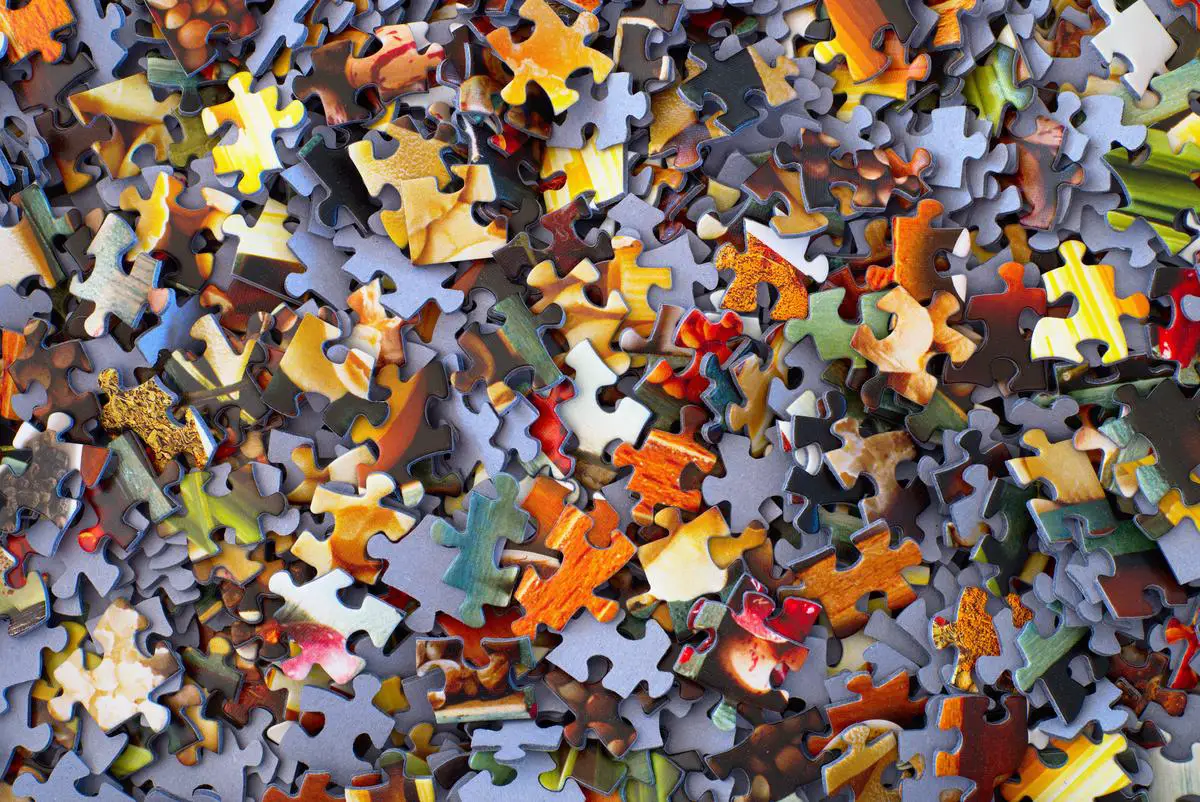 Illustration of a person overcoming technological barriers in understanding stable diffusion prompts by connecting puzzle pieces representing technology, education, and internet connectivity.